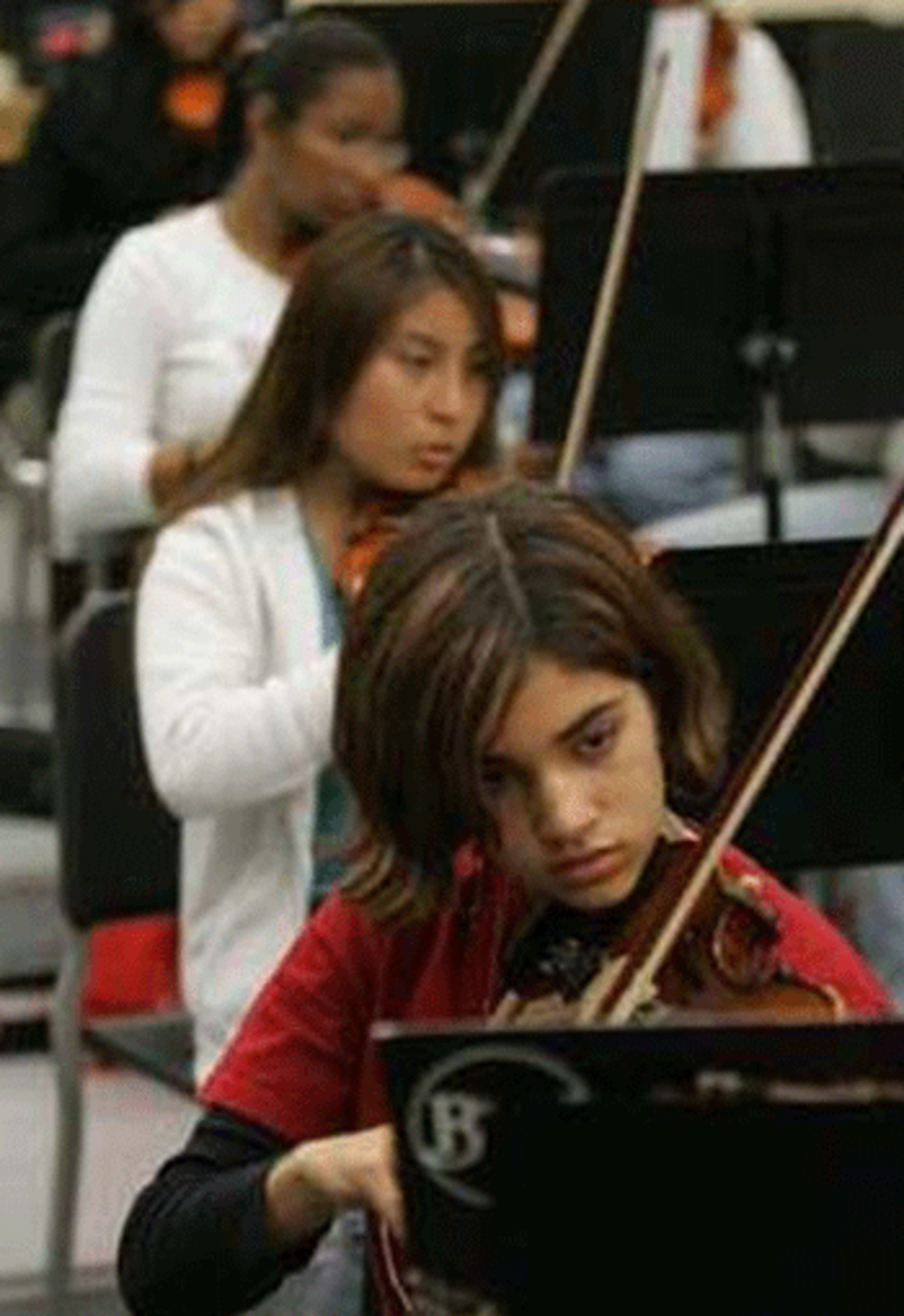 Leslie Cardenas, front, and Sara Flores rehearse as part of the Harmony Project in this 2007 photo. (Photo Credit: Richard Hartog / Los Angeles Times)