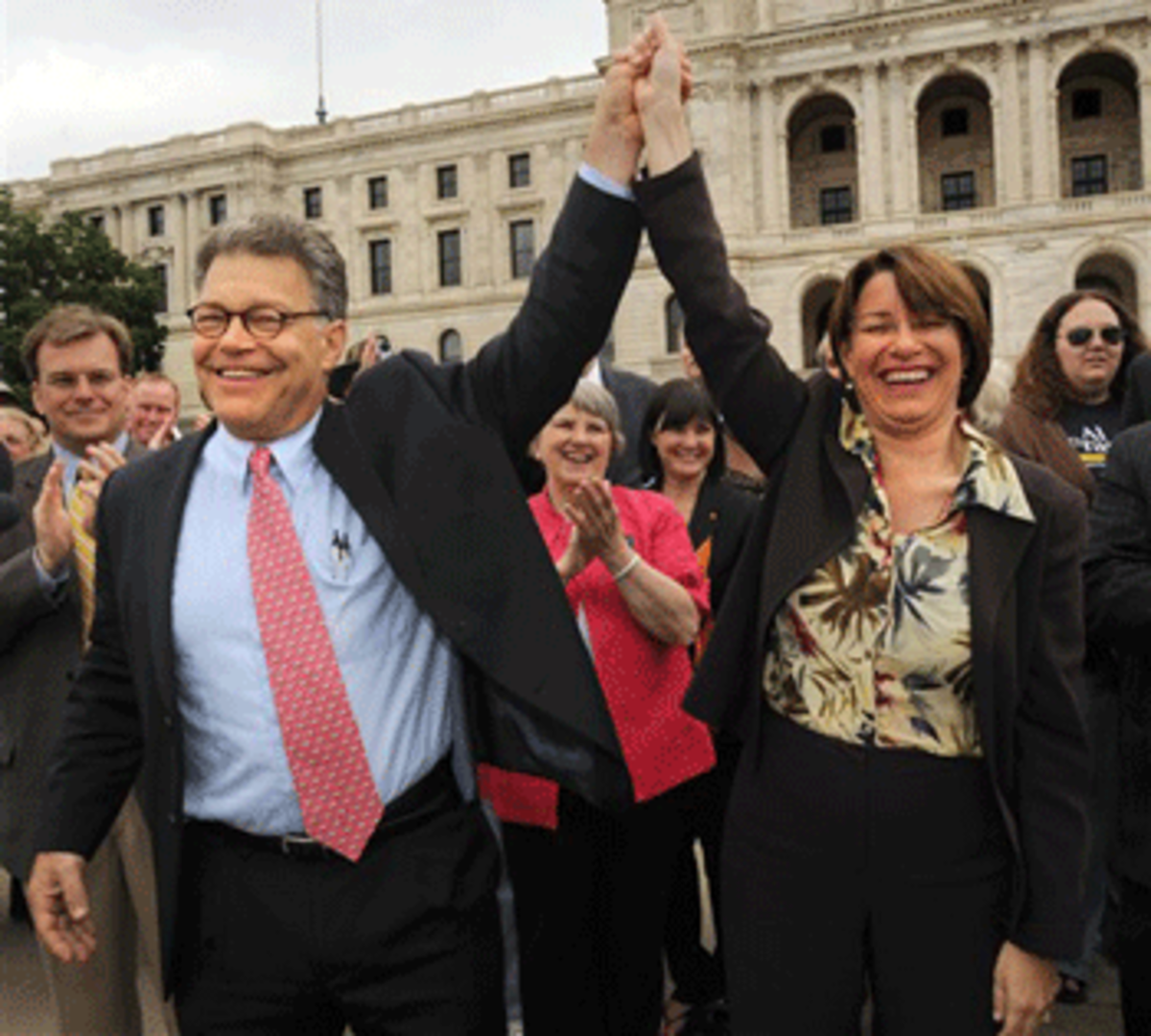 Minnesota U.S. Senators Al Franken and Amy Klobuchar. (AP Photo /Craig Lassig)