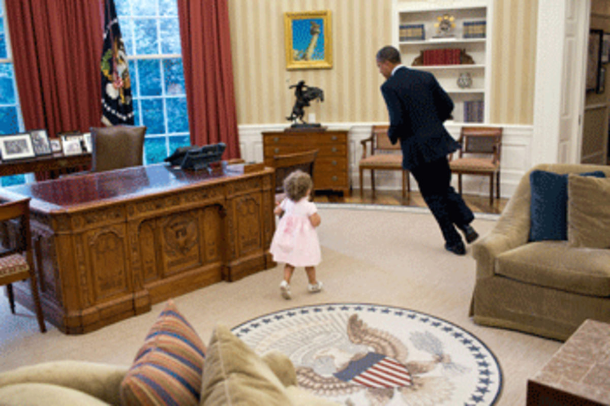 child chasing obama