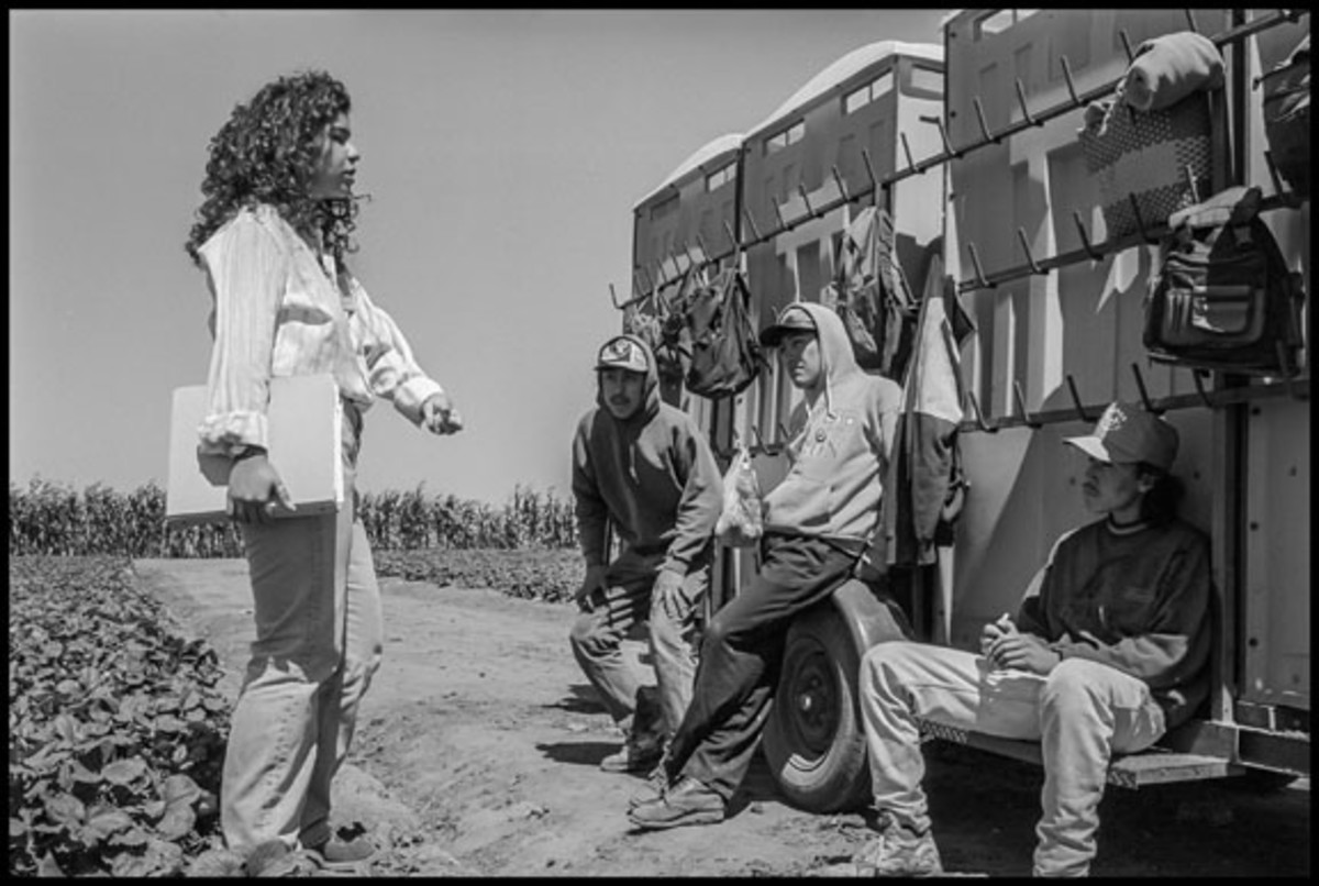  Susana Cervantes, a Union Summer intern and student from East Los Angeles, talks to strawberry pickers on their lunch break during the first year of a big UFW organizing drive in 1997.