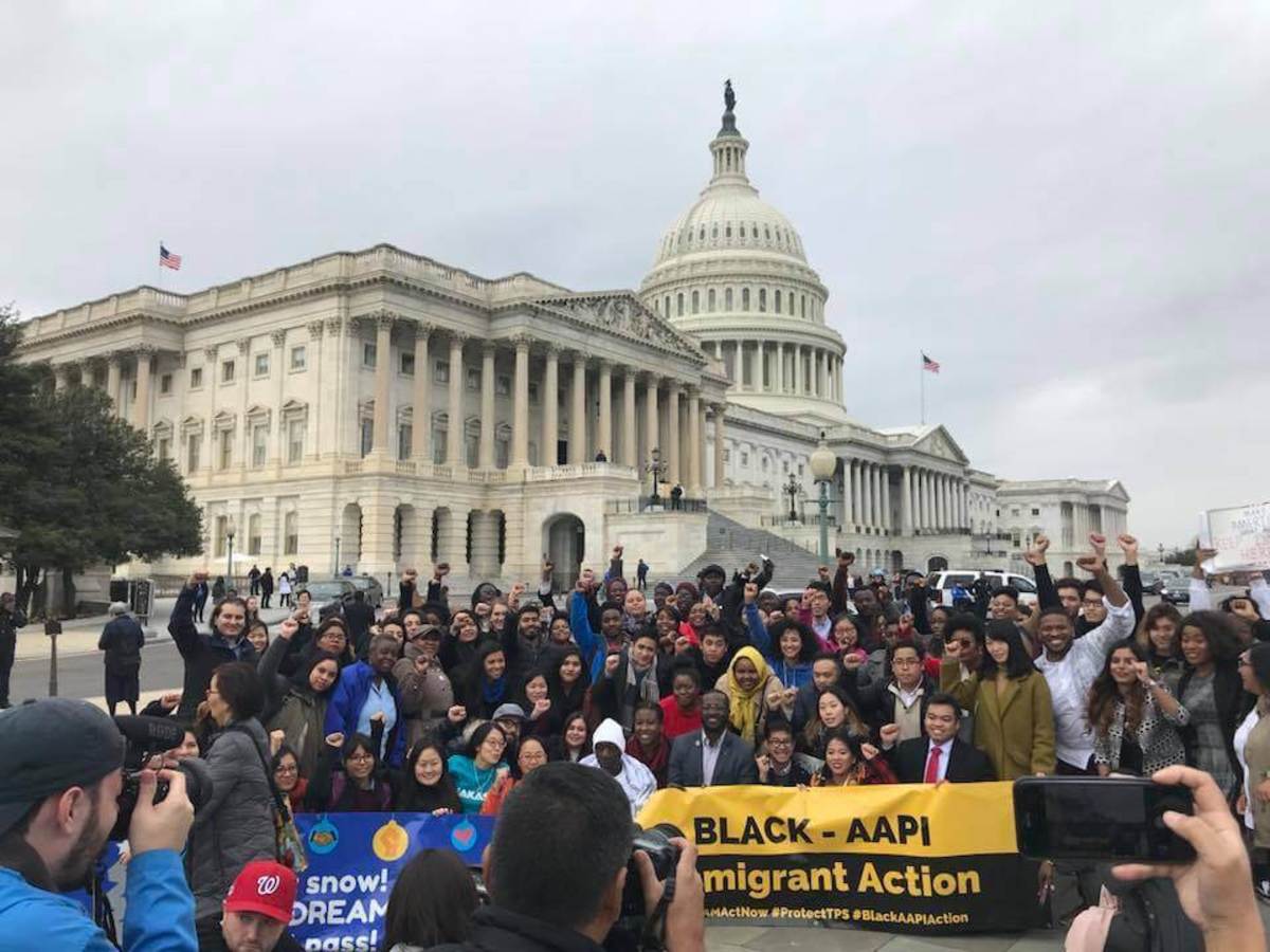 “My liberation is bound to yours.” In December 2017, the UndocuBlack Network made history with its Black AAPI Action Day as black and Asian American-Pacific Islander immigrants stood in solidarity in Washington, D.C. (UndocuBlack Network / Facebook)