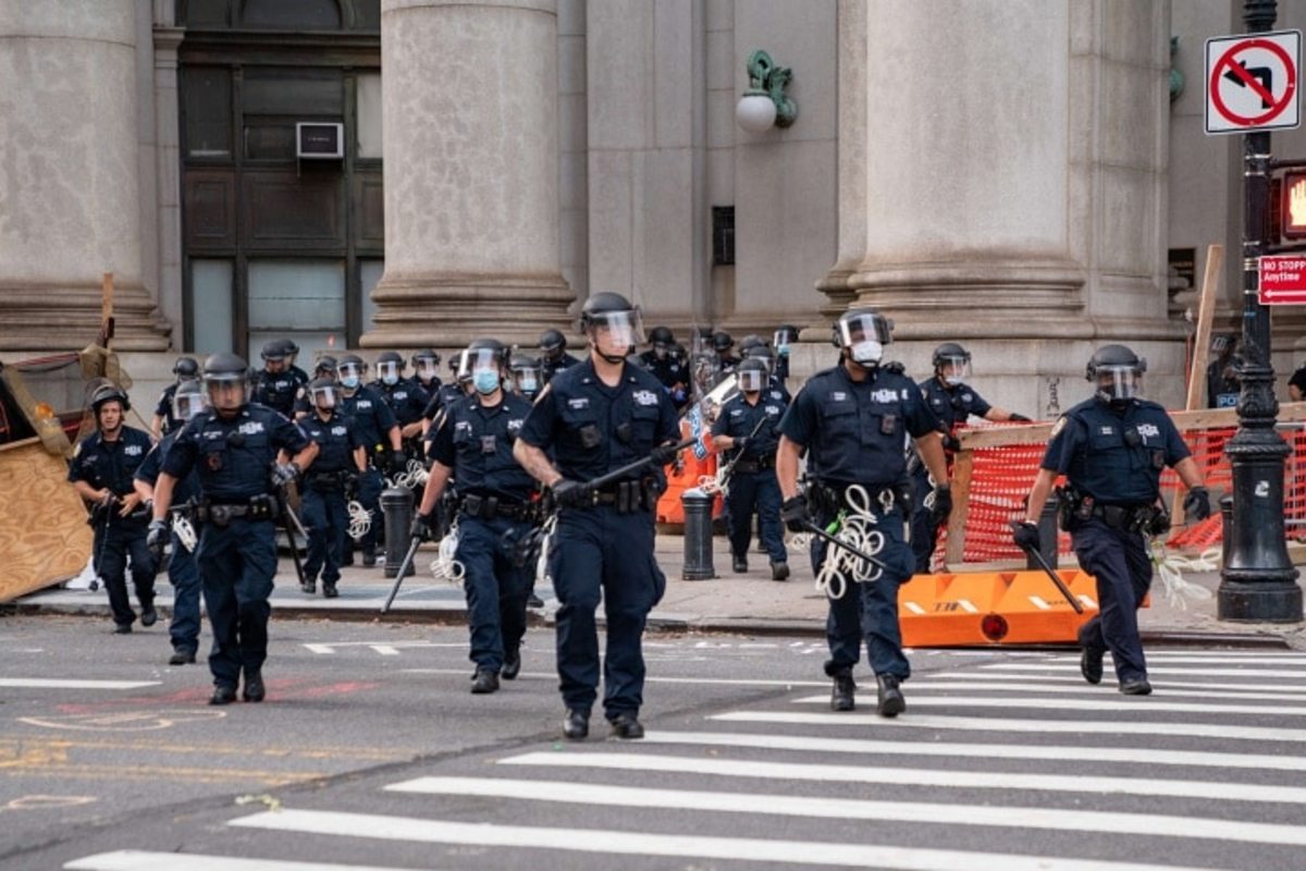 Police officers approach protesters near City Hall on July 1, 2020, in New York City.