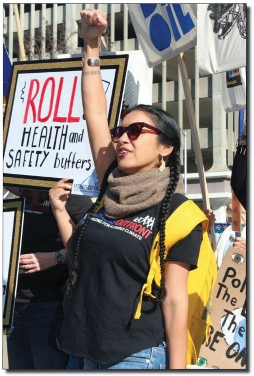 Adelita Serena of Mothers Out Front stands up for health and safety buffers around oil and wells at a rally at the State Capitol this year before Governor Newsom's State of the State. (Photo by Dan Bacher)