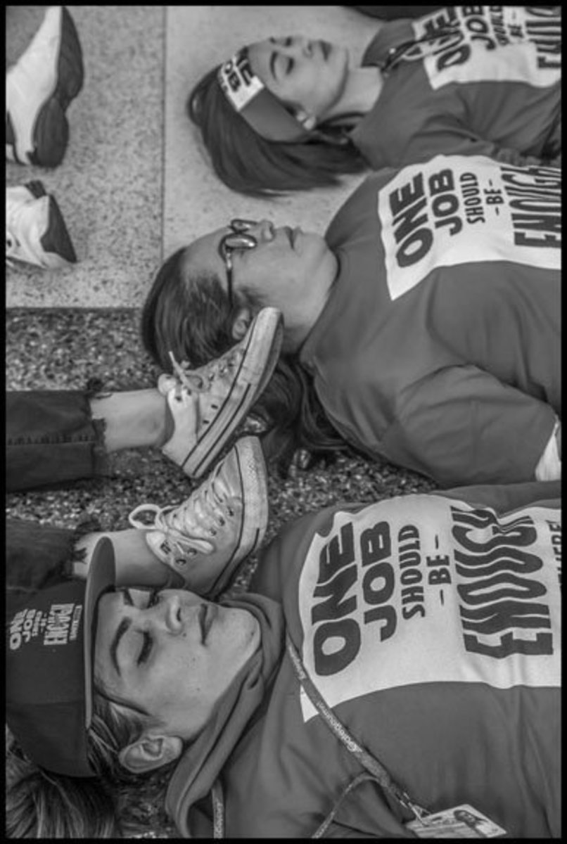 Airline kitchen workers conduct a die-in at the American Airlines terminal at SFO.