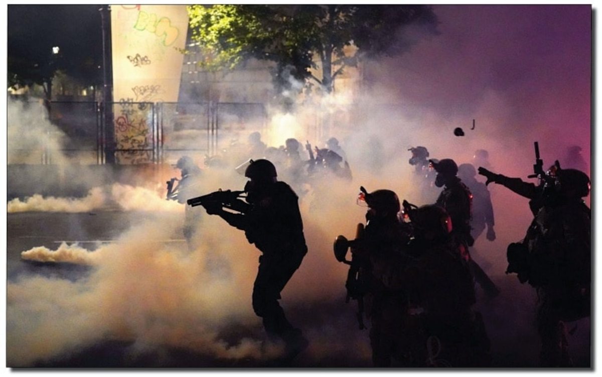 Federal officers deploy tear gas and less-lethal munitions while dispersing a crowd of about a thousand protesters in front of the Mark O. Hatfield U.S. Courthouse on July 24, 2020, in Portland, Oregon.