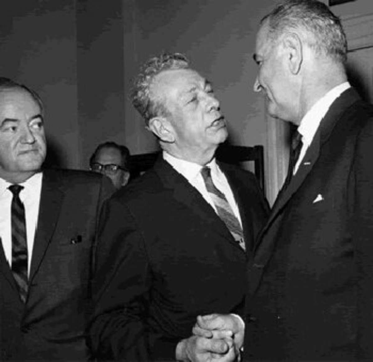 Democrats and Republicans working together: Hubert Humphrey, Everett Dirksen, and Lyndon Johnson.