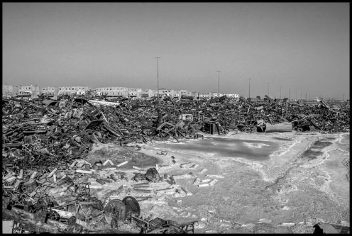dnbbasra127.jpg  BASRA, IRAQ - 26MAY05 - The wreckage of war - tank treads and turrets - in the middle of a residential neighborhood.  The wreckage includes depleted uranium ammunition, a big health hazard to residents.Copyright David Bacon