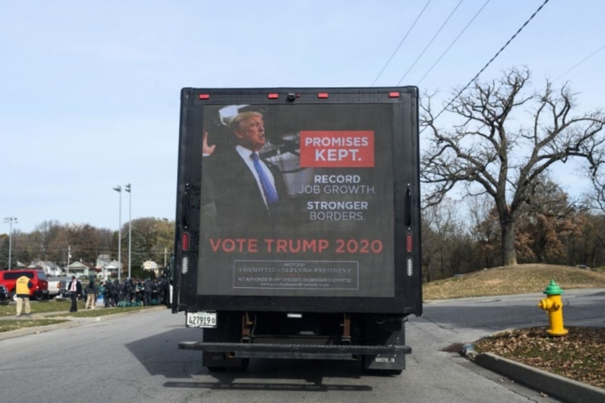 DES MOINES, IA - NOVEMBER 09: A mobile billboard, displaying an advertisement for President Donald Trump's 2020 campaign, drives around outside the Climate Crisis Summit at Drake University on November 9, 2019 in Des Moines, Iowa. Democratic presidential candidate Sen. Bernie Sanders (I-VT) and U.S. Rep. Alexandria Ocasio-Cortez (D-NY) will be speaking at the event. (Photo by Stephen Maturen/Getty Images)