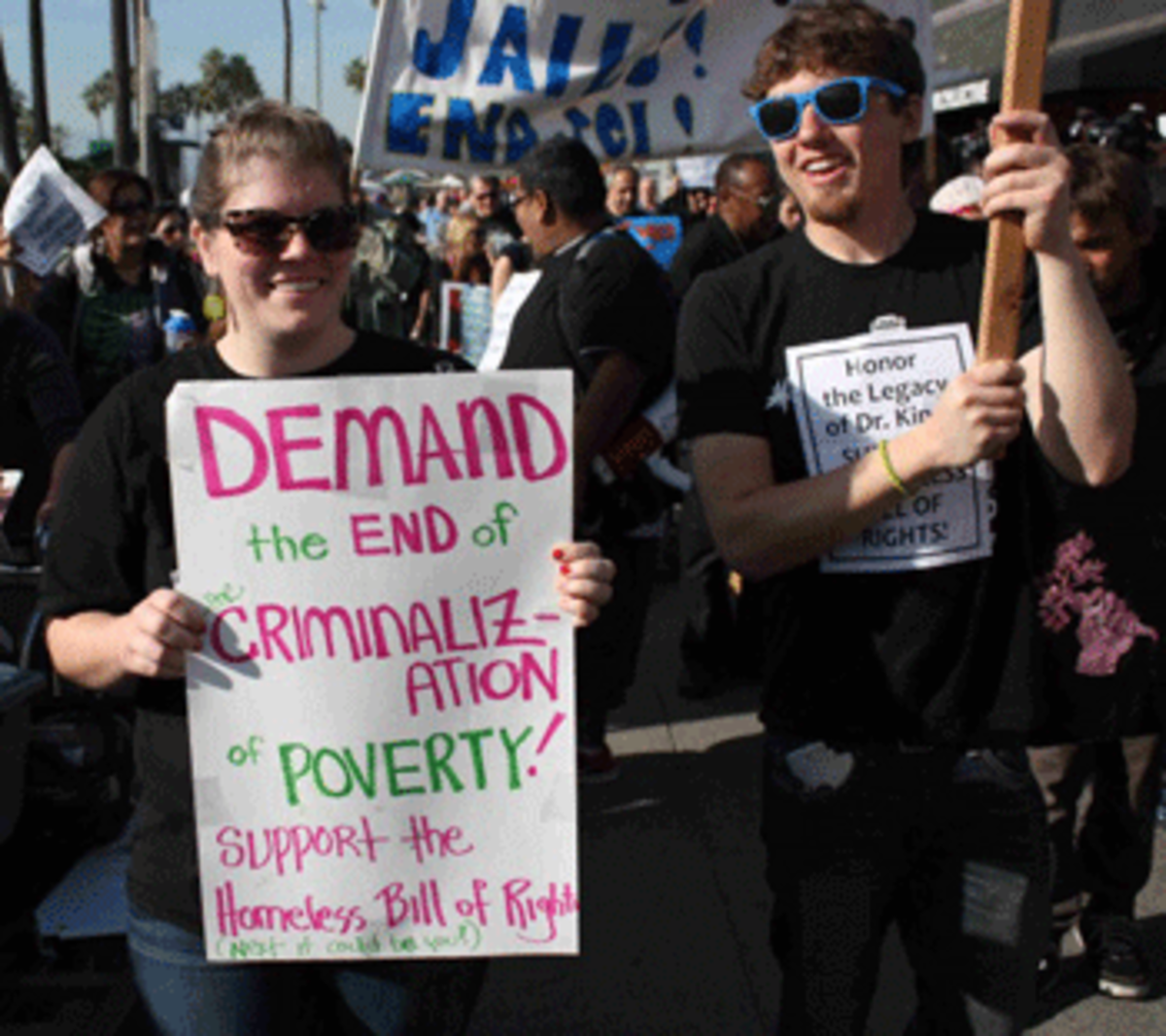 Homeless advocates march down the Venice boardwalk on Jan. 18 to raise awareness of laws targeting the homeless and the campaign for California to adopt a Homeless Bill of Rights. (Dan Bluemel / LA Activist)