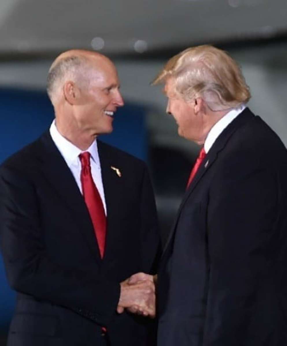 U.S. President Donald Trump greets then-governor of Florida Rick Scott during a campaign rally in Pensacola, Florida on November 3, 2018. (Photo: Nicholas Kamm / AFP via Getty Images)