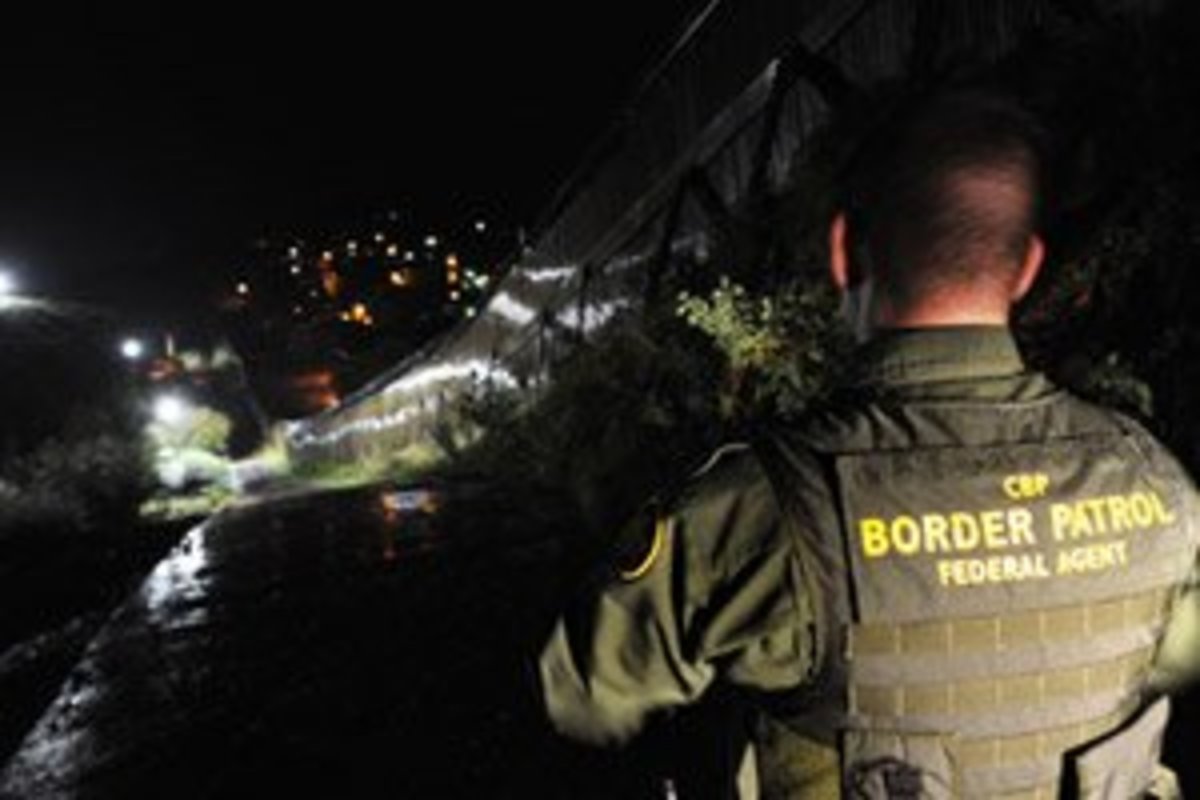 U.S. Border Patrol agent Richard Funke patrols along the border fence between Arizona and Mexico at the town of Nogales on July 28, 2010. (Mark Ralston/AFP/Getty Images)
