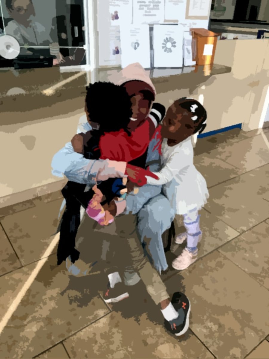 Kenia Charles with her children during a visit at a Department of Children and Family Services office last year. Photo courtesy of Charles.