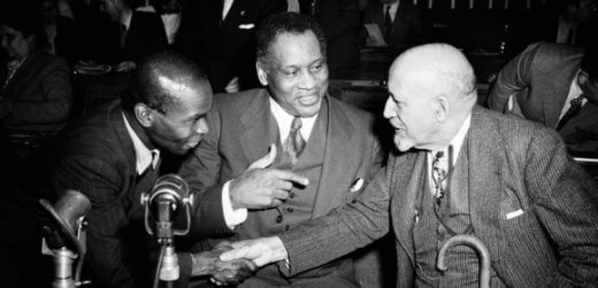 Actor/Singer Paul Robeson, center, introduces Peter Blackman of the West Indies to W.E.B. Du Bois at the World Peace Conference at the Salle Pleyel in Paris on April 20, 1949. ( AP Photo/Jean-Jacques Levy)