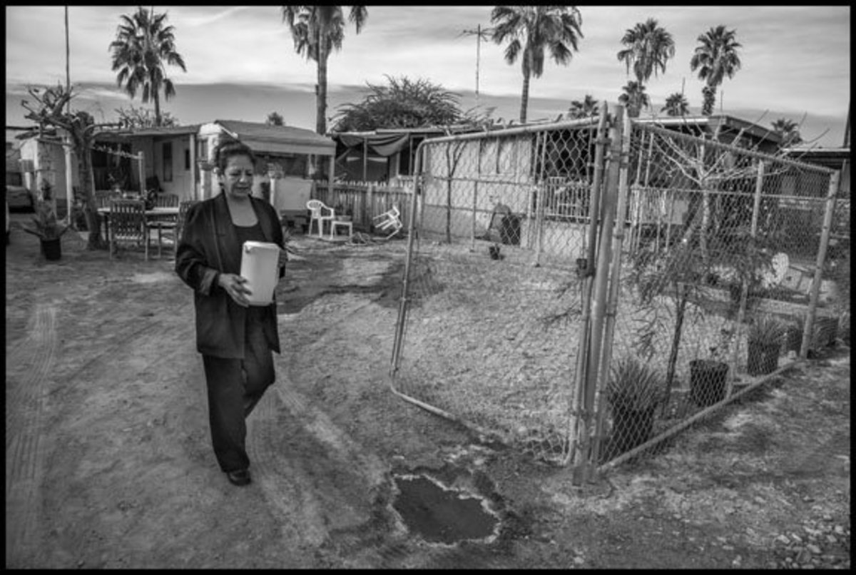 COACHELLA VALLEY, CA - 6DECEMBER10 - Ana Sanchez lives in the St. Anthony's Trailer Park near Thermal, in the desert in Coachella Valley.  The water supply of the park in contaminated, and Sanchez and the other residents have to get their drinking water from a tank.Copyright David Bacon