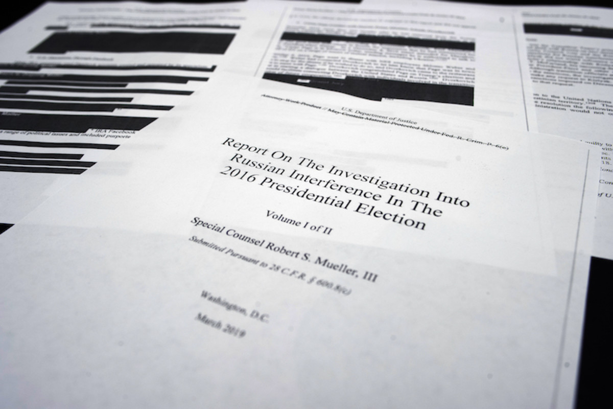 Four pages of the Mueller Report lay on the witness table in the House Intelligence Committee hearing room on Capitol Hill in Washington, D.C. on Thursday. (Cliff Owen / AP)