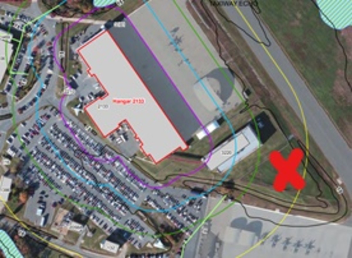 Hangar 2133, shown in red, is a “high priority” environmental site. AFFF was sent into Metcom's system and into a drainage ditch shown by the Red X.