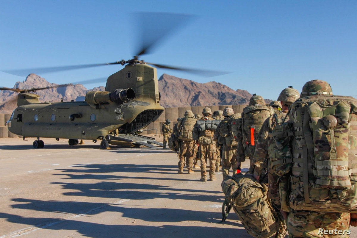 Soldiers attached to the 101st Resolute Support Sustainment Brigade, Iowa National Guard and 10th Mountain, 2-14 Infantry Battalion, load onto a Chinook helicopter to head out on a mission in Afghanistan, January 15, 2019.     1st Lt. Verniccia Ford/U.S. Army/Handout via REUTERS   ATTENTION EDITORS - THIS IMAGE WAS PROVIDED BY A THIRD PARTY. - RC110D3B25B0