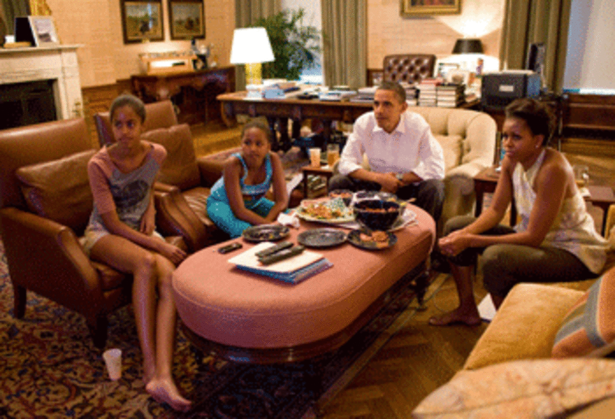 Obamas watching World Cup finals. (Photo by Pete Souza)