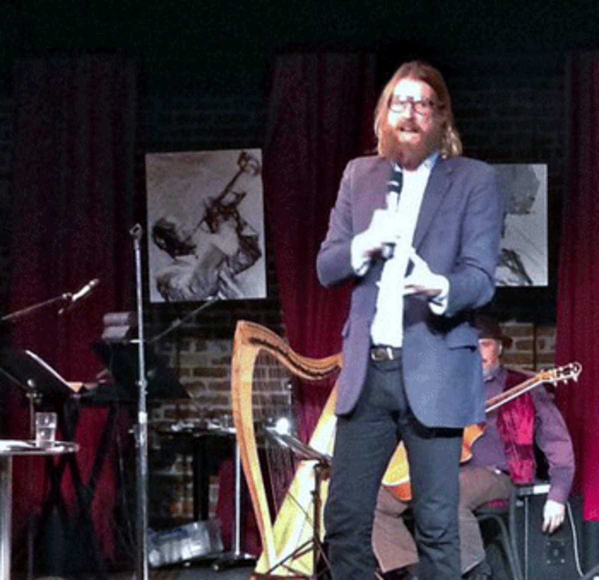 Sanderson Jones, the stand-up comedian who started a global atheist movement called Sunday Assembly, talks to the crowd at the group's first event in San Jose at Theater on San Pedro Square, Nov. 11, 2013. (Sal Pizarro)