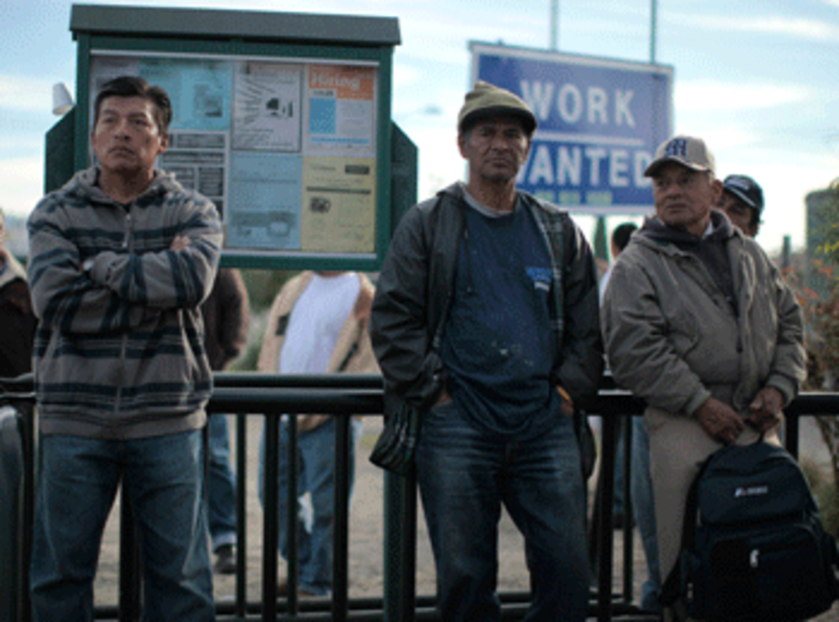 Salvador Herrera, 40, from El Salvador, Jose Castillo, 58, from El Salvador and Gerasmo Perez, 63, from Mexico wait for work at a day laborer site in Los Angeles, California, on November 23, 2011. (Reuters/Lucy Nicholson)