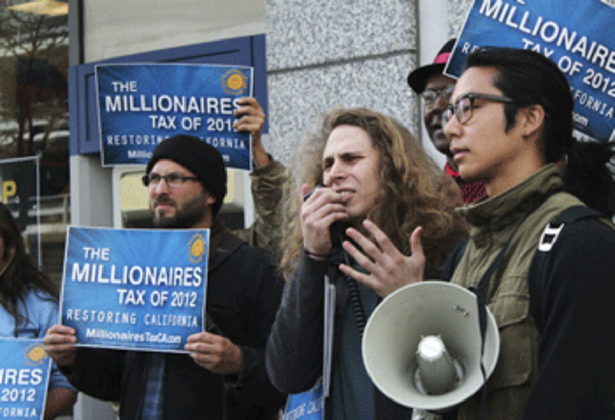 Community members gathered at the Elihu M. Harris State of California Office Building in support of the Millionaires Tax. (Daily Californian)