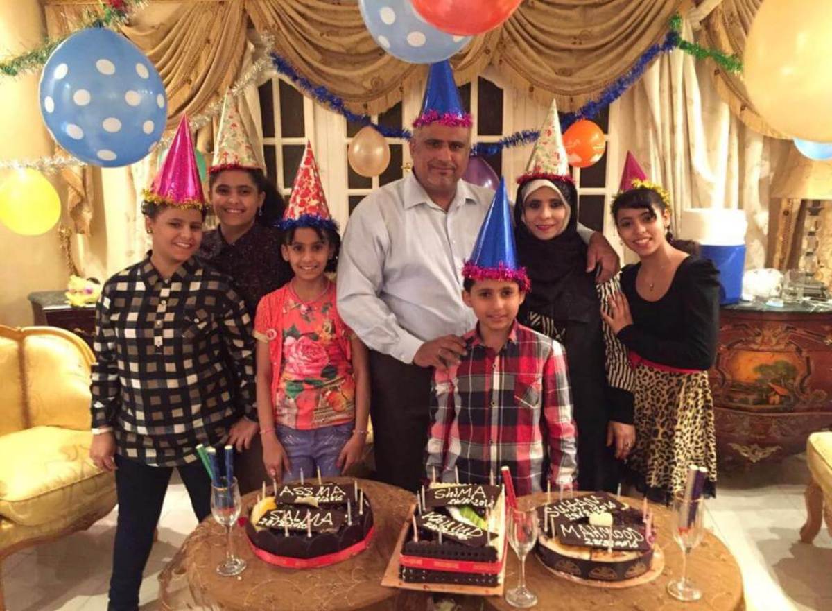 Riyadh Alhirdi and his family in Egypt in July 2017 celebrating everyone’s birthdays. This is the only time he’s seen his family over the past eight years of trying to procure asylum for them. (Michael Nigro)