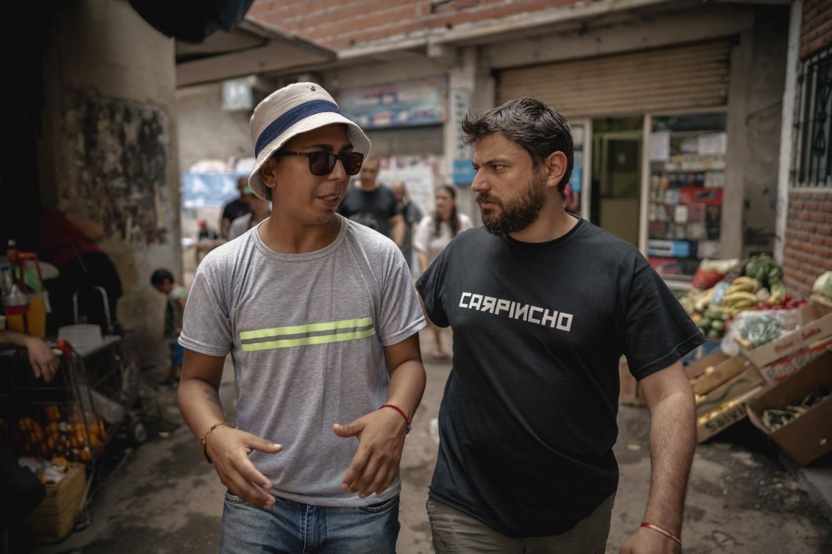 Juan Grabois, walking through Villa 31 in Buenos Aires with Marcelo Perea (left), a neighborhood social leader, in October 2021. Photo courtesy Movimiento de Trabajadores Excluídos