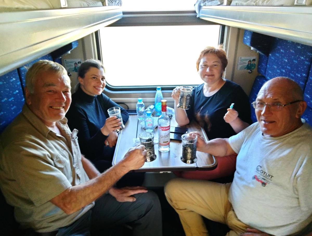 Rick with train compartment companions
