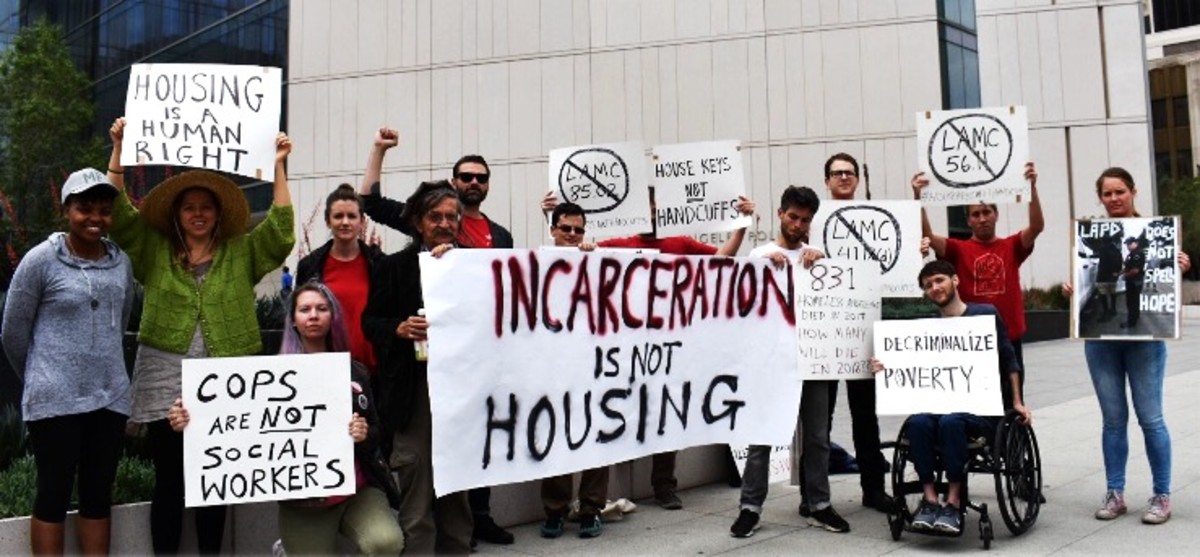 Housing activists calling for “House keys, not handcuffs.”