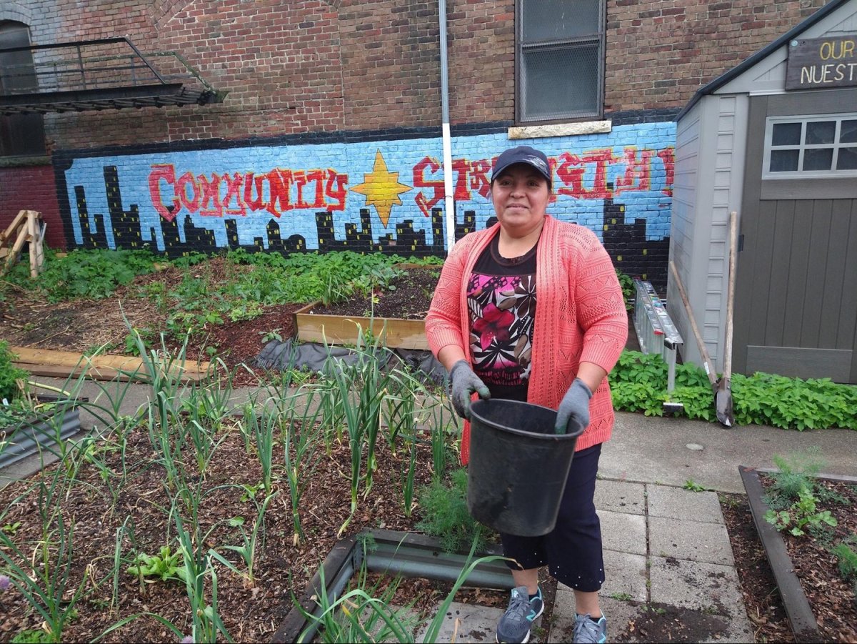 Juana Sánchez, a Salvadoran immigrant, oversees the Our Garden / Nuestro Jardín site of the nonprofit organization Eastie Farm in the East Boston neighborhood of Boston, Mass. on June 1, 2022. Photo by Laura Carmen Arena for palabra.