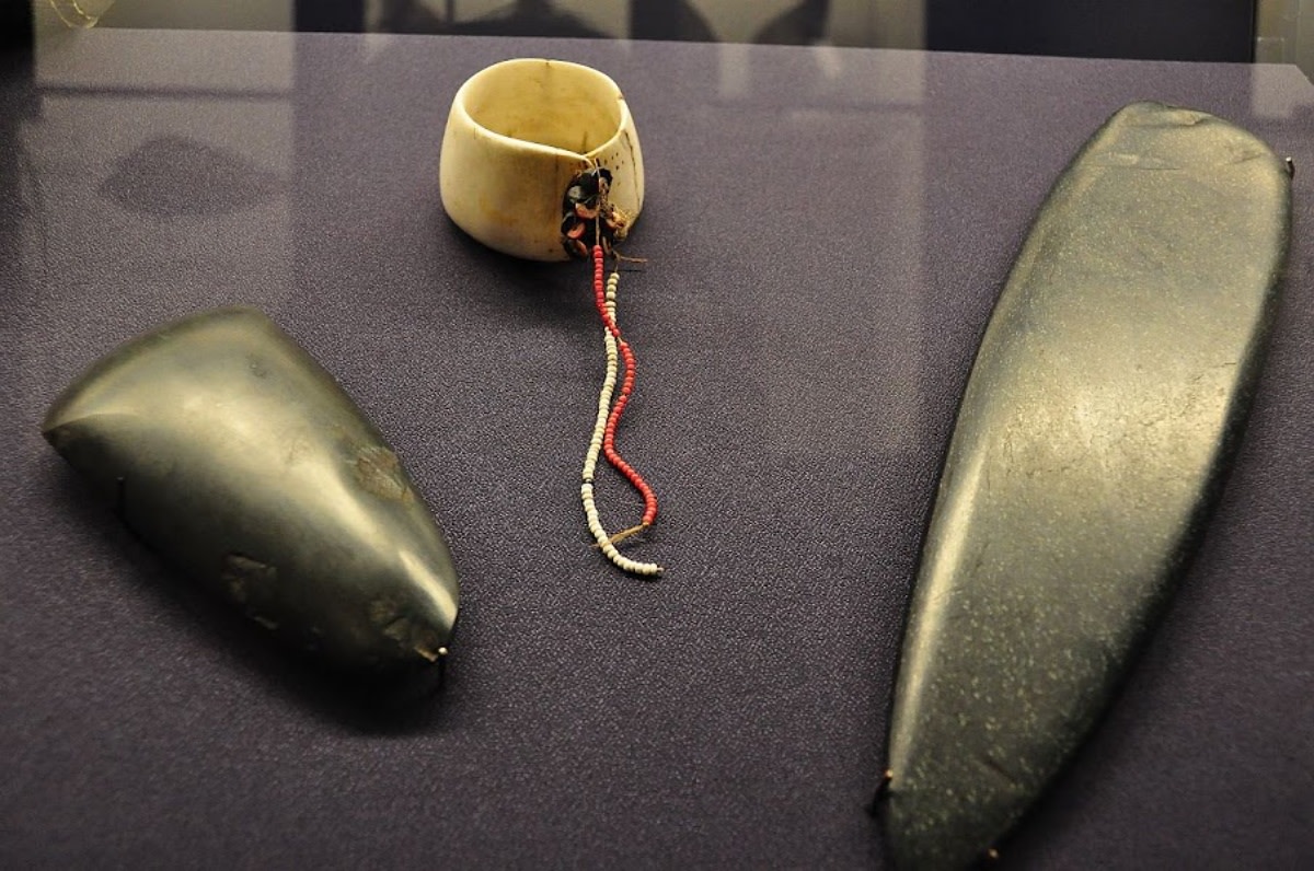 Tools of the trade: An ax from Milne Bay Province and a mwal shell from the Trobriand Islands, traditionally used as part of the Kula ring trade alliance in Papua New Guinea, on display at the Macleay Museum in Sydney, New South Wales, Australia. (Photo credit: JC Merryman/Flickr, CC BY-SA 2.0)