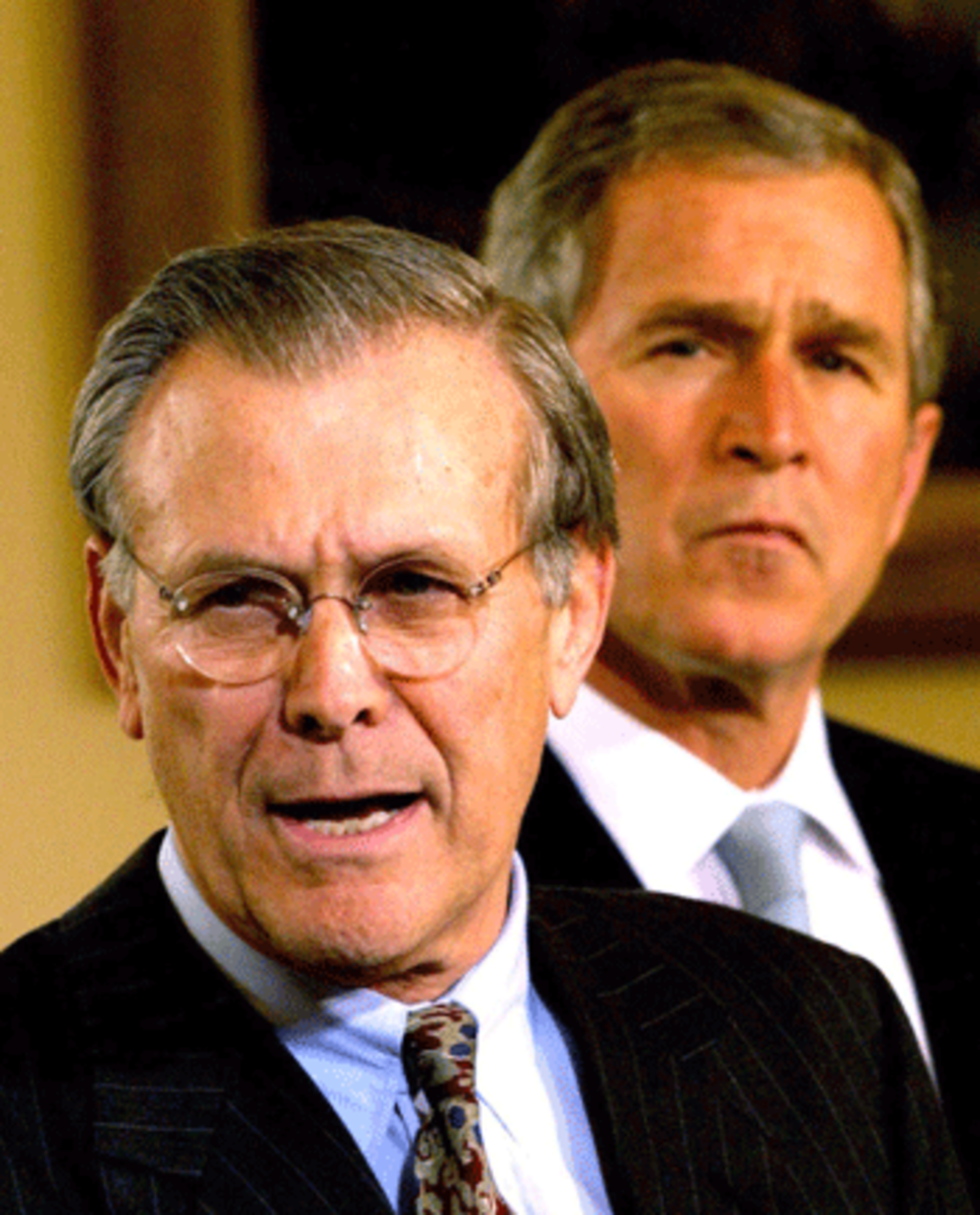 rumsfeld_resigns Donald Rumsfeld & George Bush