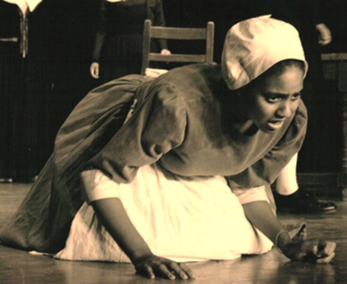Tituba-crying Krystle Collins portraying the slave Tituba in Arthur Miller's "The Crucible"